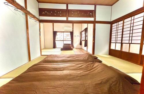 Yahatanishi House | ゲストハウスEn 折尾駅前邸