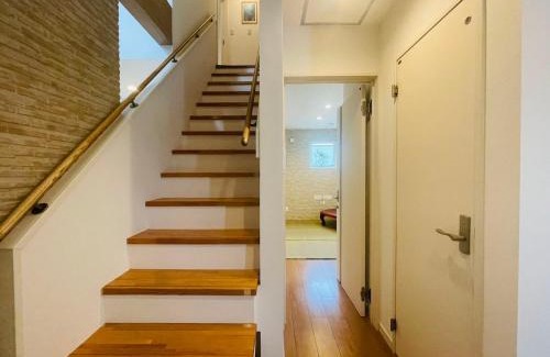 Okinawa Ski Chalet | 空港まで車で15分ビーチまで徒歩1分海沿いの閒雲斎