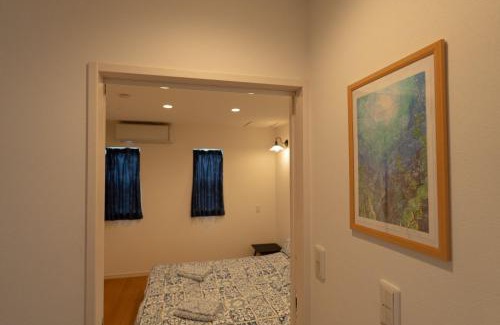 Okinawa Ski Chalet | 空港まで車で15分ビーチまで徒歩1分海沿いの閒雲斎