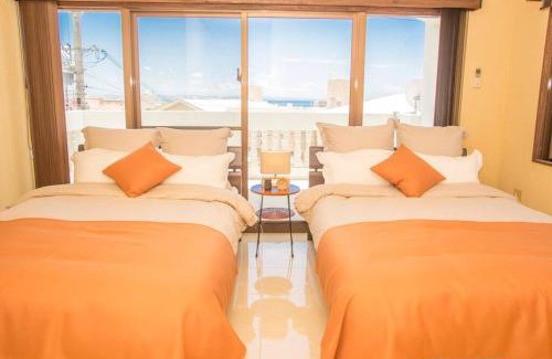 Kadena-cho Villa | 【観光地へのアクセス抜群】読谷村/1棟貸切/最大10名宿泊/駐車場2台/お風呂3つ/Wi-Fi