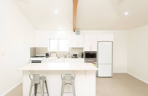Norfolk Island Ski Chalet | 1 bedroom 1 bath house w patio incl car