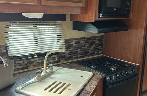 Centerville House | 1-bedroom RV in lovely Leona with a lake to fish and swim! Exotic animals!