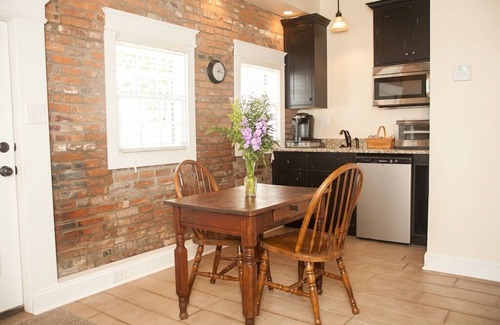 St. Charles Cottage | 1830's Luxury Brick Cottage, Cozy Fireplace, right off the Cobblestone Streets!