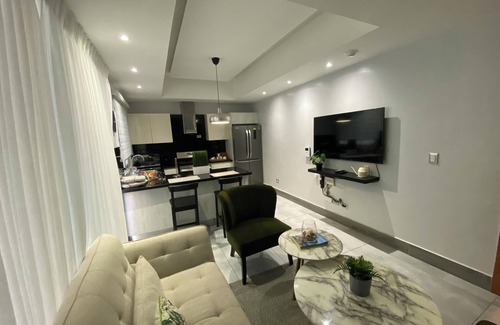 Ensanche Quisqueya Condo | 1Br- LUX Location, Pool, Sauna, GYM -no need car for accommodation-