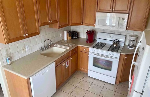 Wildwood Crest Condo | 2-Bd Condo, Pool and Views of Sunset Lake. Watch the fireworks from the porch!