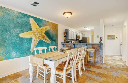 Bel Air Apartment | 3-Story Lagoon Haven: Dock & Resort Amentities