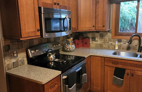 Holt House | 5-Star 3 bedroom home with heated pool and hot tub! 10 minutes away from MSU