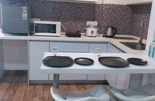 Surat Apartment | 5mints to Airport! Family sized cosy place swimming pool, garden, gym & playarea