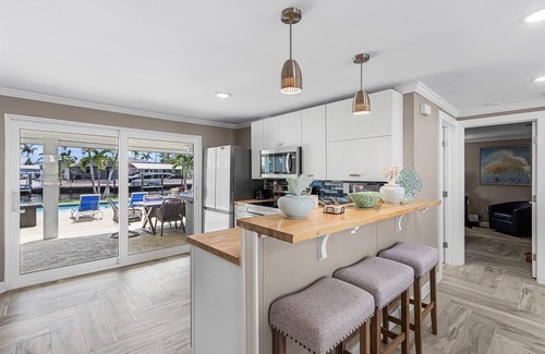 South Island House | 7 Dockside Dream: 3BR/3BA Pool Home w/Canal Access!