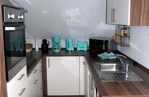 Dannewerk Apartment | 70 sqm for up to 4 people in Dannewerk Schleswig-Holstein. Car parking space and storage room for e-bikes, washing machine, full bathroom with bathtub, high chair and travel cot are available Bedding for the travel cot please bring your own.