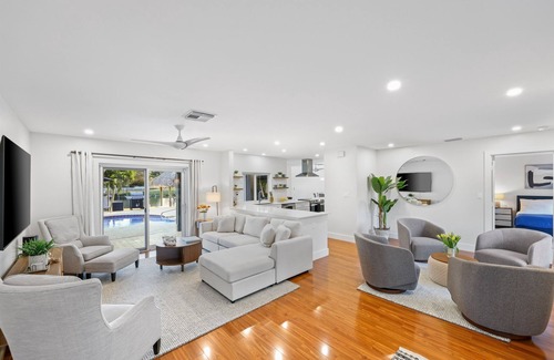 Tropic Palms House | 796 Serene 4BR Villa: Heated Pool, Tiki Hut & Waterfront Views in Delray Beach!