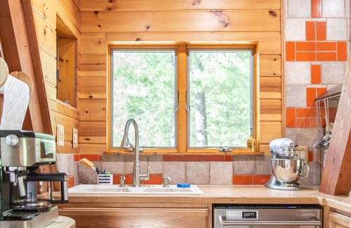 Thompsonville Cabin | A-Frame Cabin on Betsie River – Private Dock & Fishing Near Crystal Mountain