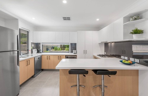 Dakabin House | A tranquil bushland retreat with KB, Ducted AC and access to a heated pool.