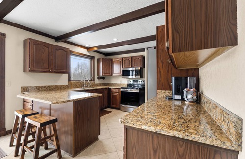 Grand Blanc House | Acorn House - 3 bedroom home with an inground pool, hot tub and a gas fireplace!