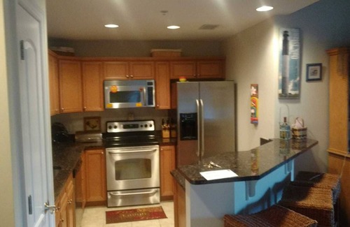 Yaupon Beach Condo | Adorable two bedroom beach condo with private beach, pool and hot tub