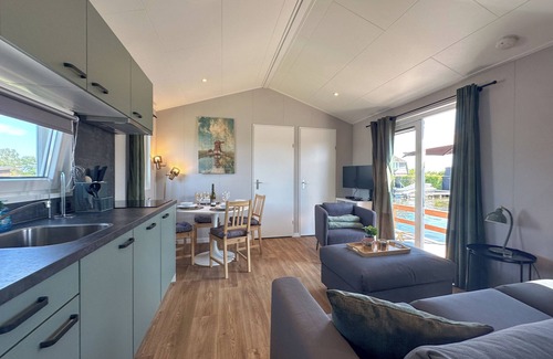 Municipality of Stichtse Vecht Boat Rental | Air-conditioned chalet with waterside terrace