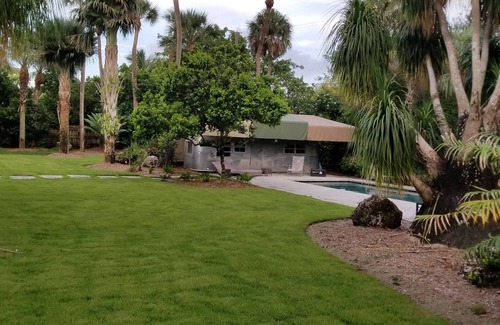 Palmetto Bay Apartment | Airstream pool house, heated pool, lavish gardens, waterfalls, very private.