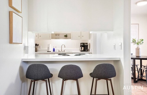Hancock Apartment | Airy King Bedroom + Comfortable Living Space by UT