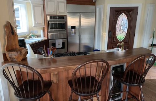 Cannon Beach House | Amazing ocean & estuary views! Relax on the deck (hot tub & fire-pit)