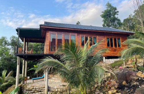 Ham Ninh Ski Chalet | Amazing sunrise over wooden house at the East