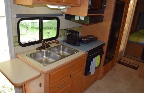 Villars-le-Grand House | American Ford Hurricane motorhome, with slide.