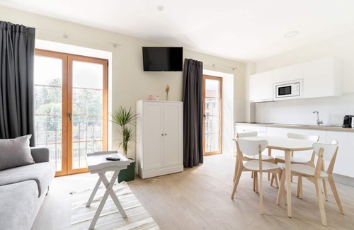 Villaverde de Pontones Apartment | Apartment for families or couples with double whirlpool bath and garden view.