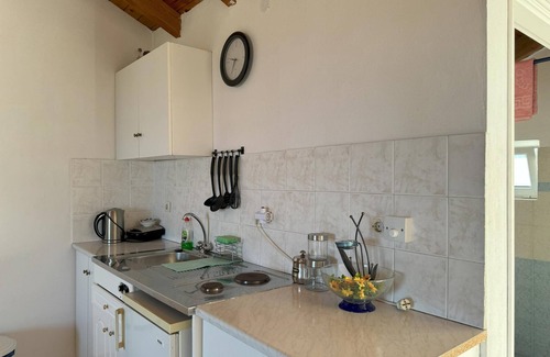 Kompi Apartment | Apartment above Peroulia beach near Koroni - taverna in front of the house