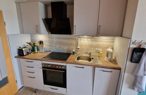 Schillig Apartment | Apartment 'Ferienwohnung 25 Strandkorb, 50 Qm' with Sea View, Balcony and Wi-Fi