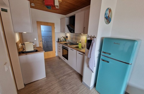 Schillig Apartment | Apartment 'Ferienwohnung 25 Strandkorb, 50 Qm' with Sea View, Balcony and Wi-Fi