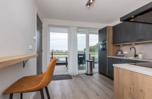 Sint-Annaland Apartment | Apartment in Sint-Annaland with Water Views