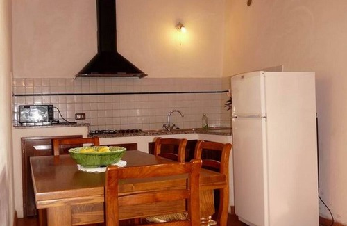 Torrita di Siena Apartment | Apartment with a beautiful covered terrace in front of the pool