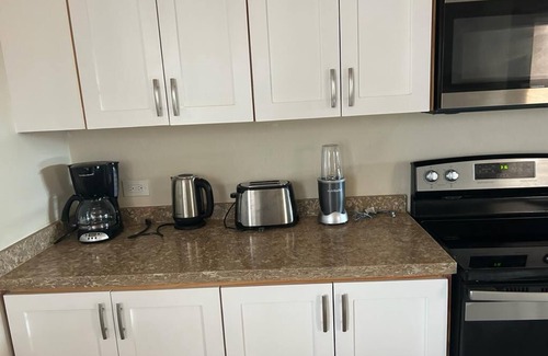 Enterprise House | Apt #1-Newly built apartments, great for families/friends, minutes walk to beach