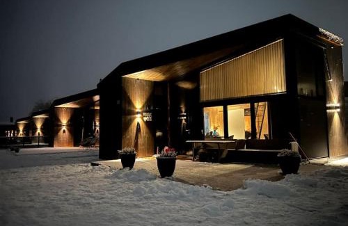 Nes Municipality House | Attraktiv & smart funkishytte på Nes Strandhager.