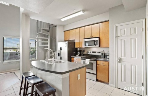 West Campus Apartment | Balcony Skyline View Spiral Staircase Near UT