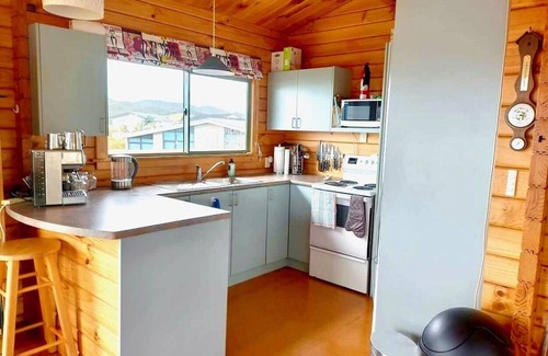Whangaruru House | Beachfront Bland Bay tranquility with stunning sea views from sun-drenched deck