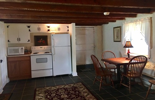 Buckingham House | Beautiful 1815 cottage with solid beams, slate floor and two fireplaces.
