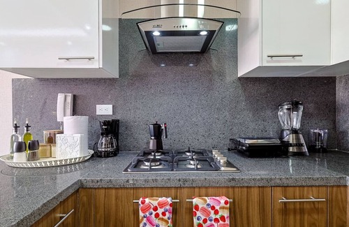 Evaristo Morales Apartment | Beautiful and Cozy 1BR Centric Condo, Full AC, King Bed, Pool.