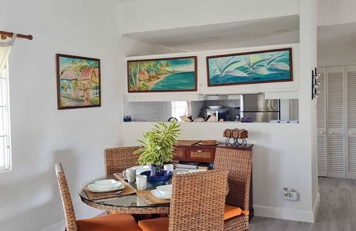 Marine Gardens Condo | Beautiful Condo with breezy Balcony Overlooking Pool & Garden – Steps to Beach