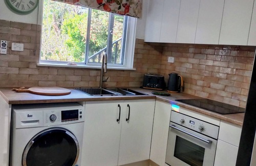 Kiama Apartment | Beautiful eclectic studio with lush private garden and solar heated pool