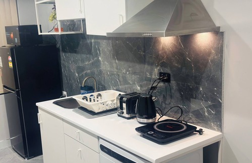 Hammond Park House | Beautiful Family room with newly renovated bathroom and Kitchenette.