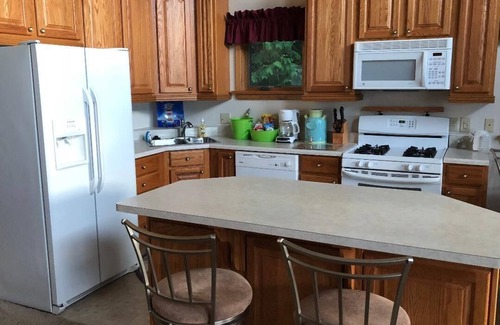Onaway House | Black Lake sunset waterfront home 78' private sandy beach on prestine Black Lake