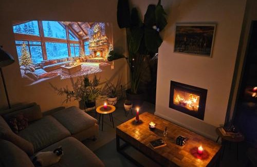Izvoarele Villa | Black Walnut House with indoor outdoor fireplace