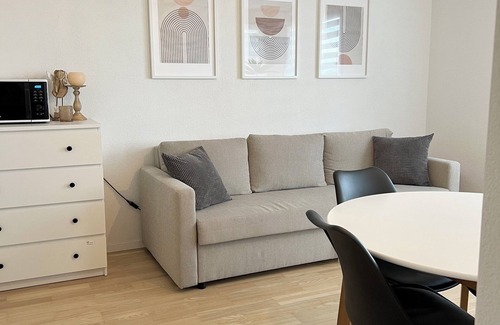 Oberuzwil Condo | Black & White Apartment