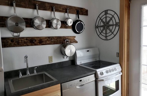 Cheticamp Apartment | Boat house on the sea.