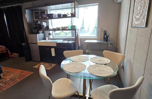 Greater Belhaven Apartment | Bohemian Industrial Studio Apartment Near Hospitals and Colleges