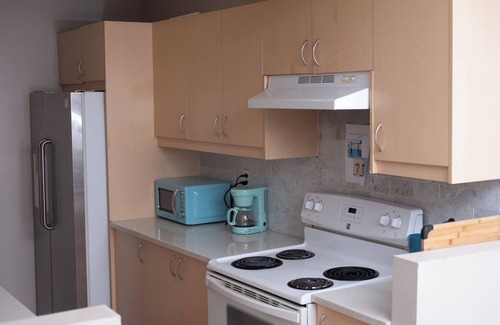 Sunnyside House | Bow River Retreat: Basement Room for Rent