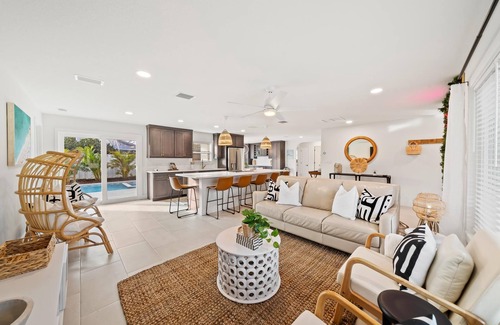 Venetian Way House | Bright and Beachy Pool Home