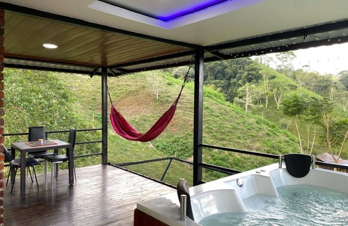 Samana Ski Chalet | Cabin in Norcasia Jacuzzi, spring water pool and extreme attractions option.