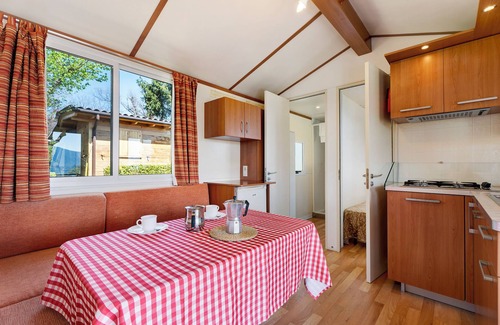 Pratolungo RV Rental | Caravan 'Mobile Home Comfort Vista Lago' with Lake View, Shared Pool and Private Garden