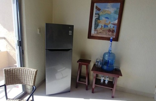 Puerto Juarez Condo | Caribbean sea is waiting for you at a discount with condo on the beach & pools